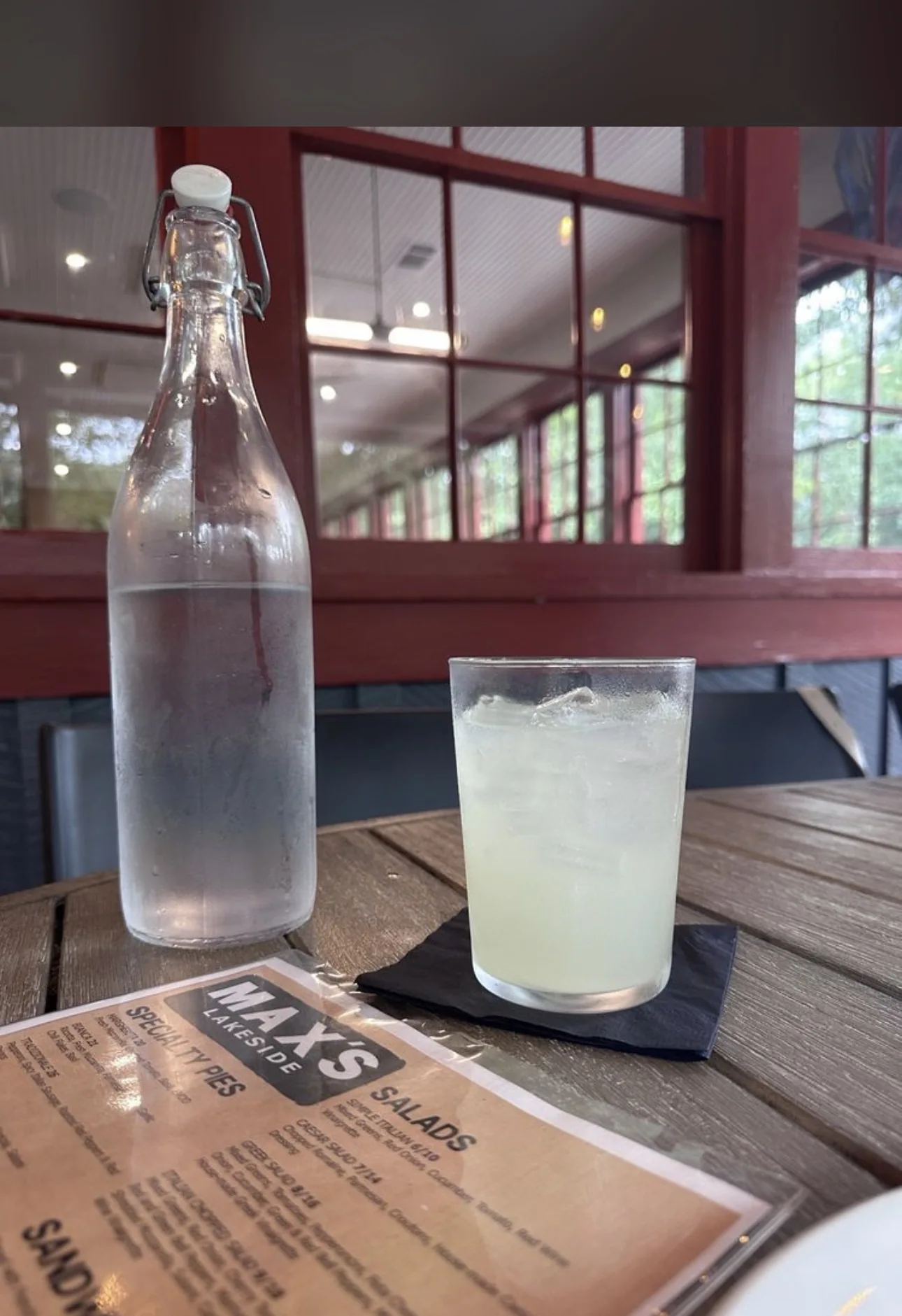 Drink and restaurant menu on an outdoor table at Max’s Lakeside